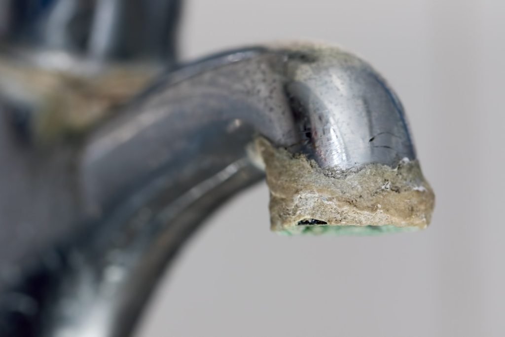 hard water calcium build-up on faucet