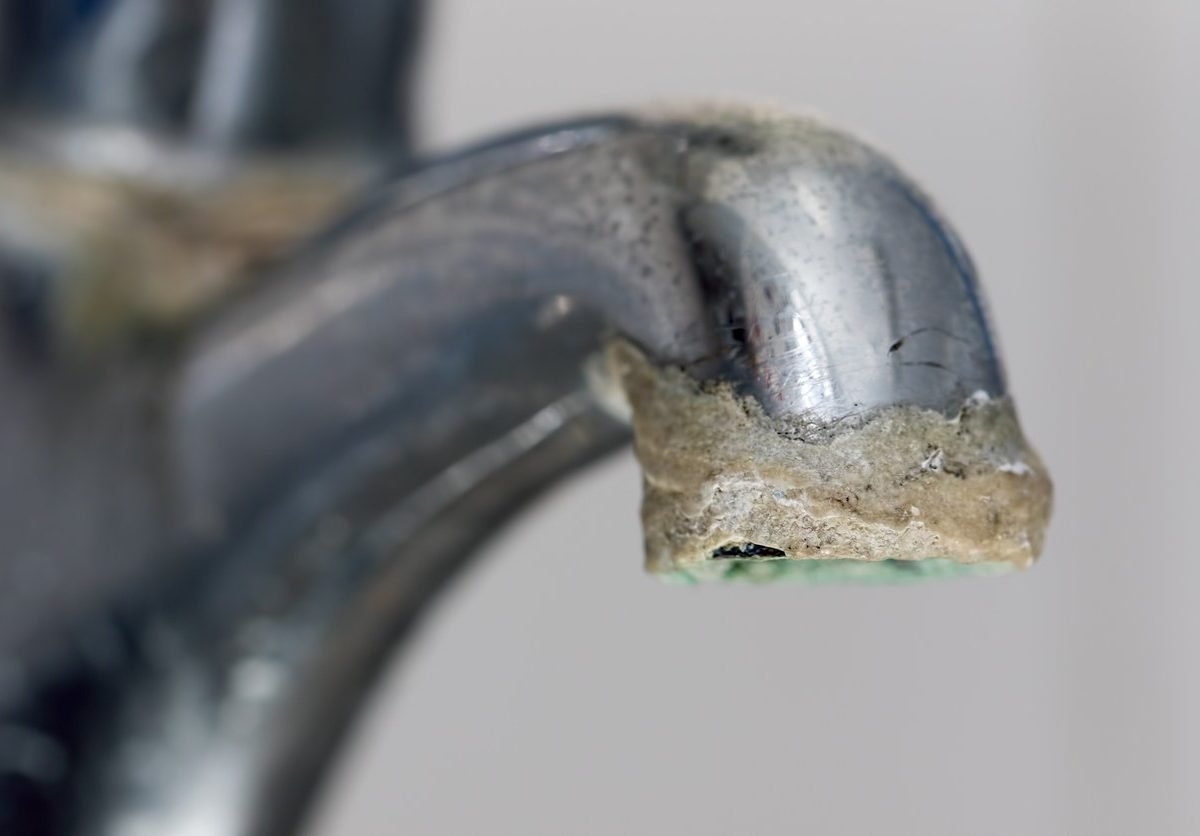 hard water calcium build-up on faucet