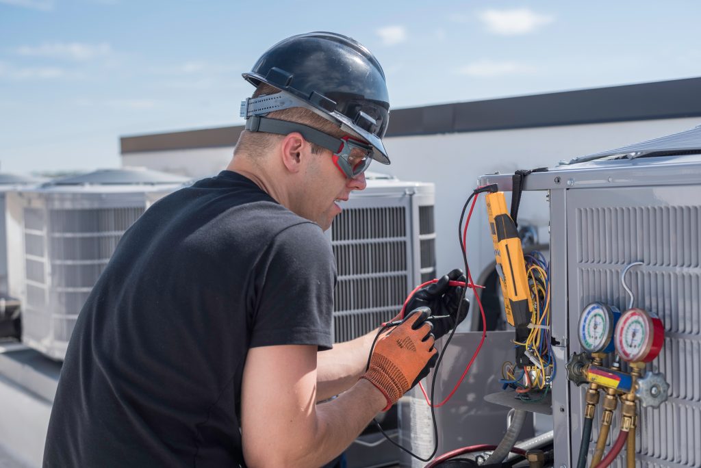 hvac service on a rooftop of a commercial building