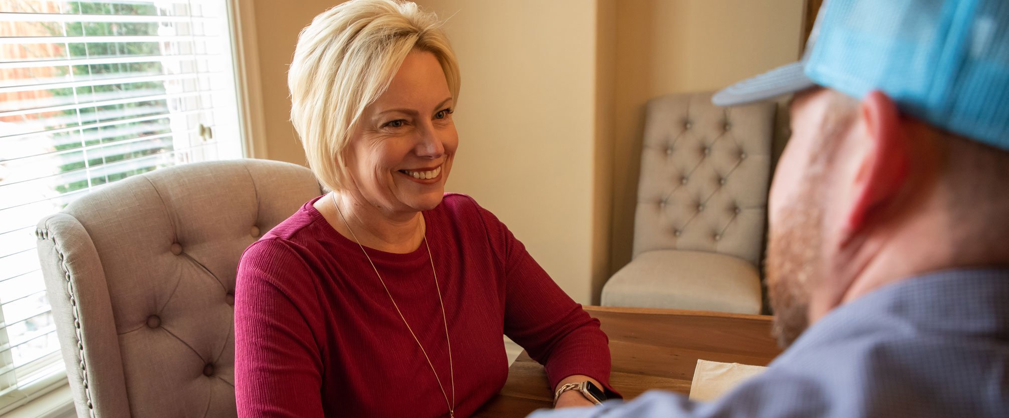 air assurance tech talking with woman