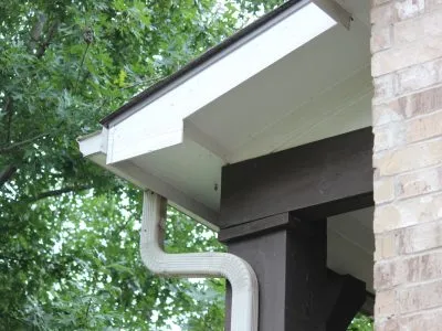 clean debris from gutters to prevent summer plumbing problems