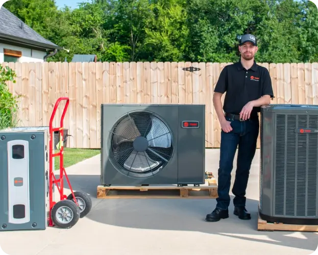 technician with Trane hvac unit
